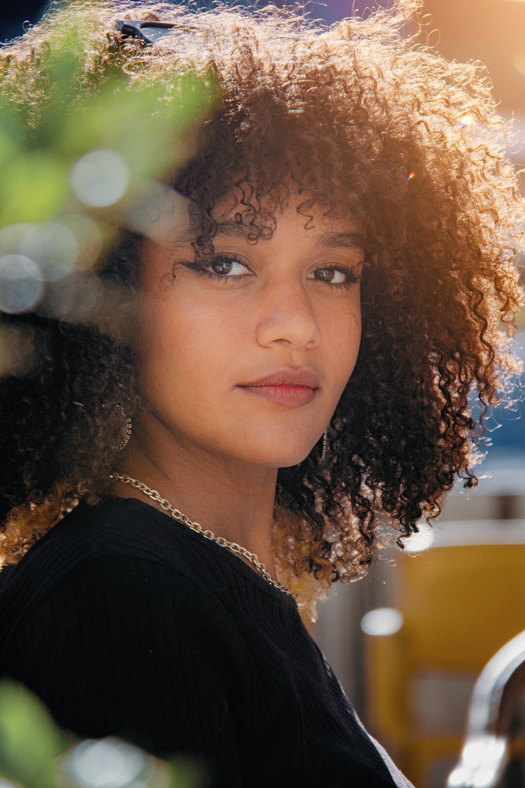 Portrait of a young woman with curly hair